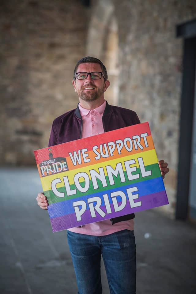 Man holding support sign for Clonmel Pride